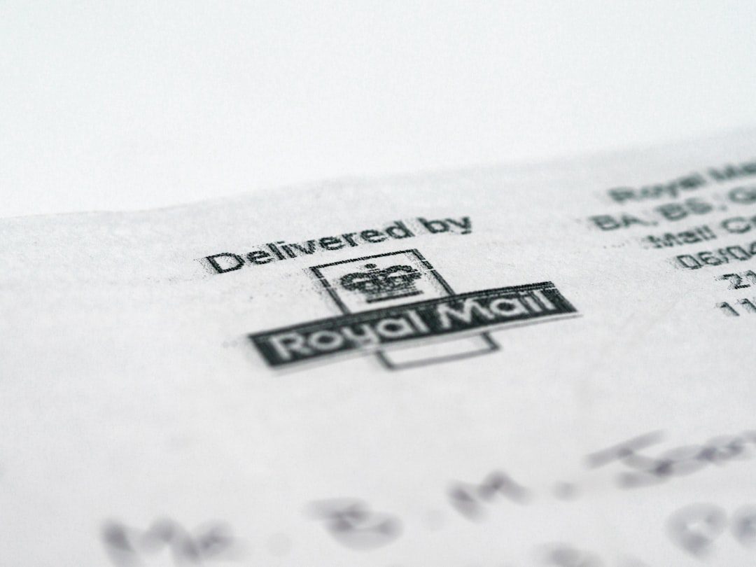 An e-commerce seller looking stressed at a complex shipping invoice
